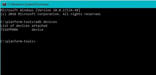 Running adb devices command showing connected Android serial number